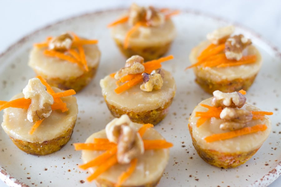 Raw mini carrot cake bites are the perfect mini dessert recipes to serve your guests. They are topped with an amazing macadamia frosting. So good! 