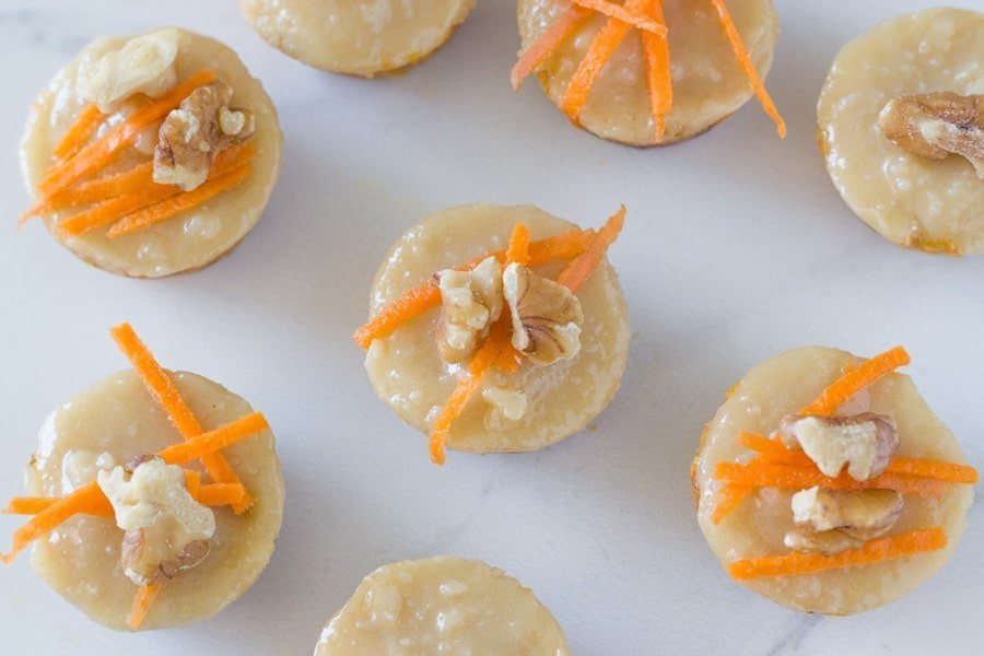 Raw mini carrot cake bites are the perfect mini dessert recipes to serve your guests. They are topped with an amazing macadamia frosting. So good! 